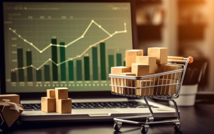 صورة مصمم بالذكاء الصناعي لعربة تسوق صغيرة بجانب لابتوب | تعبيرية freepik